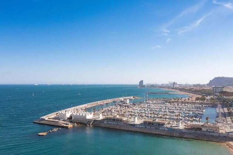 Illustrative aerial view of the Port Olímpic marina and Olympic Village district of Barcelona where the hotel is located - not a photo of the hotel building itself